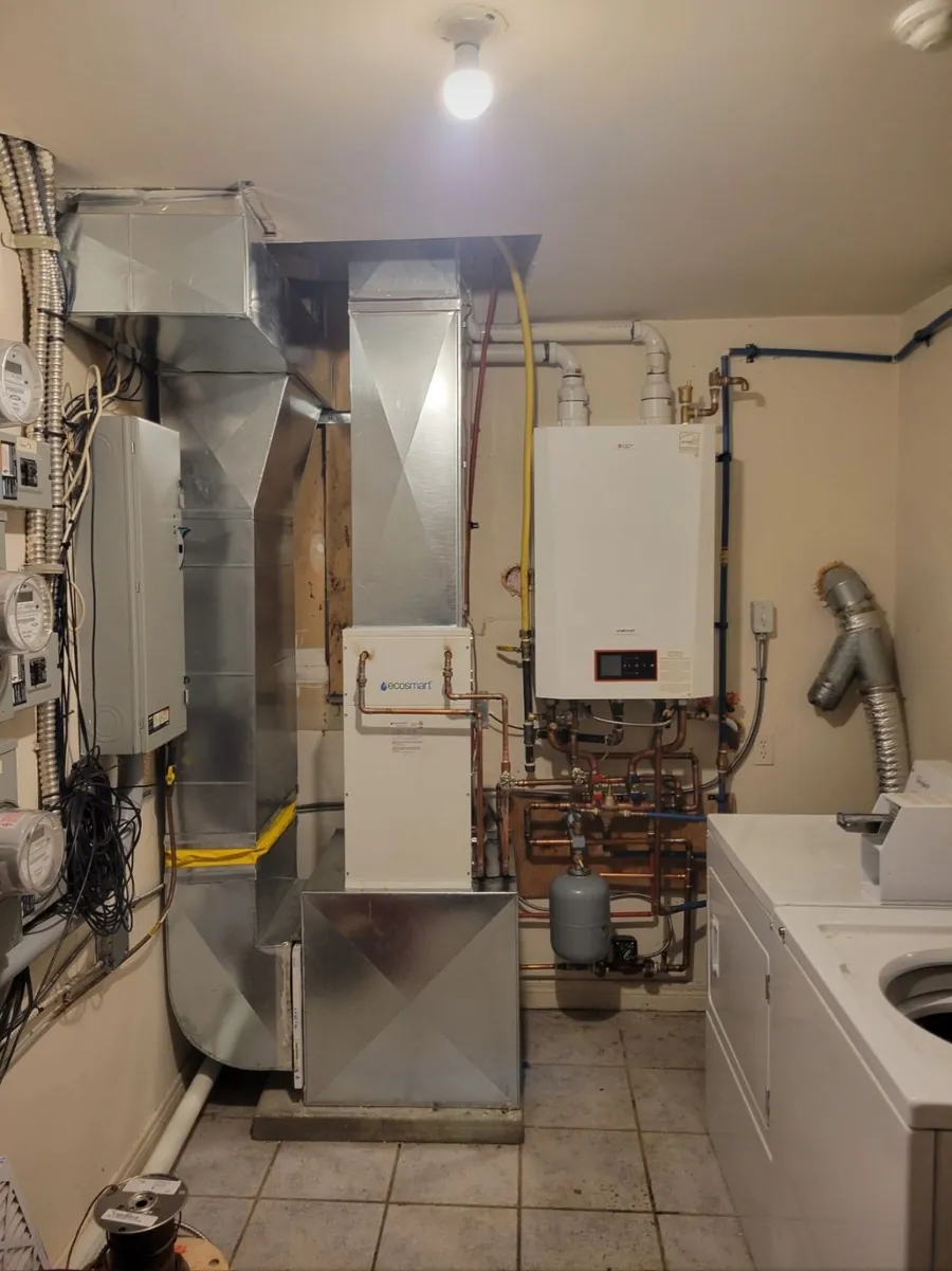 New high efficiency furnace with custom ductwork in a Windsor utility room