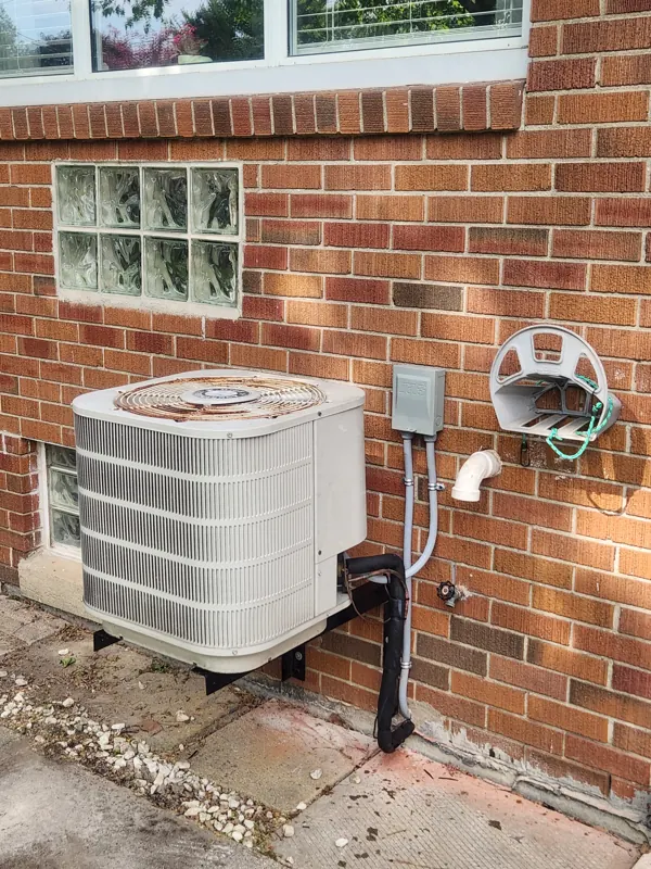 Central air conditioner installed outside a home