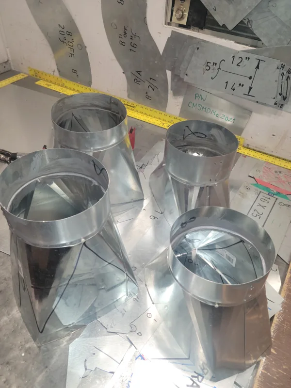 Custom galvanized round-to-square transition fittings