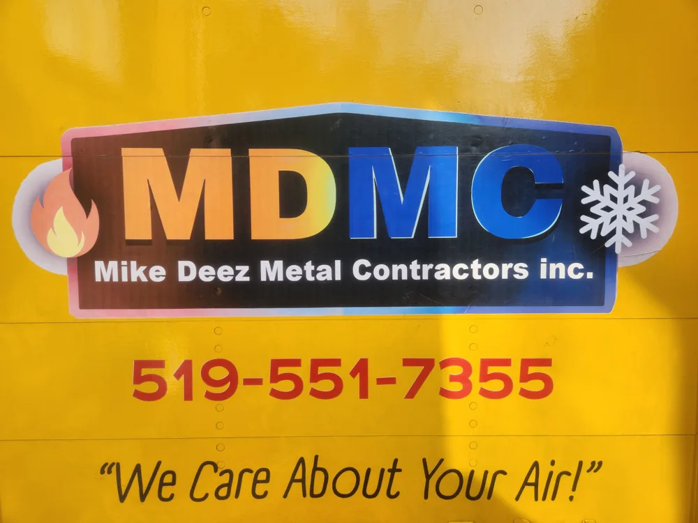 MDMC Mike Deez Metal Contractors logo on the truck