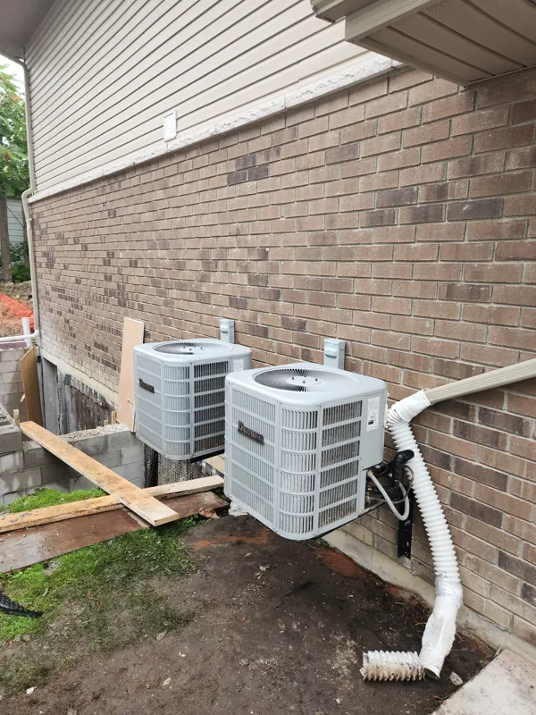 Two outdoor units installed on wall brackets